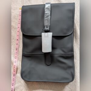 New RAINS Slim Black Backpack